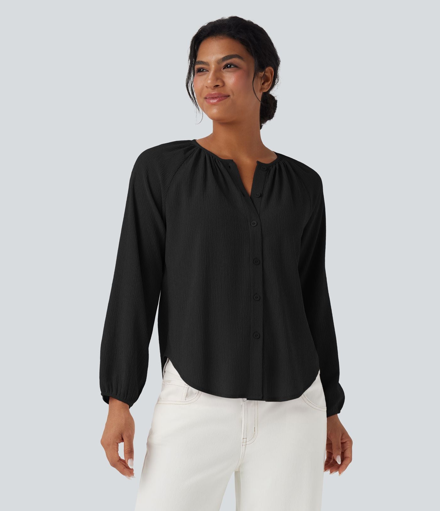 Blouse texturée col rond manches longues ourlet arrondi
