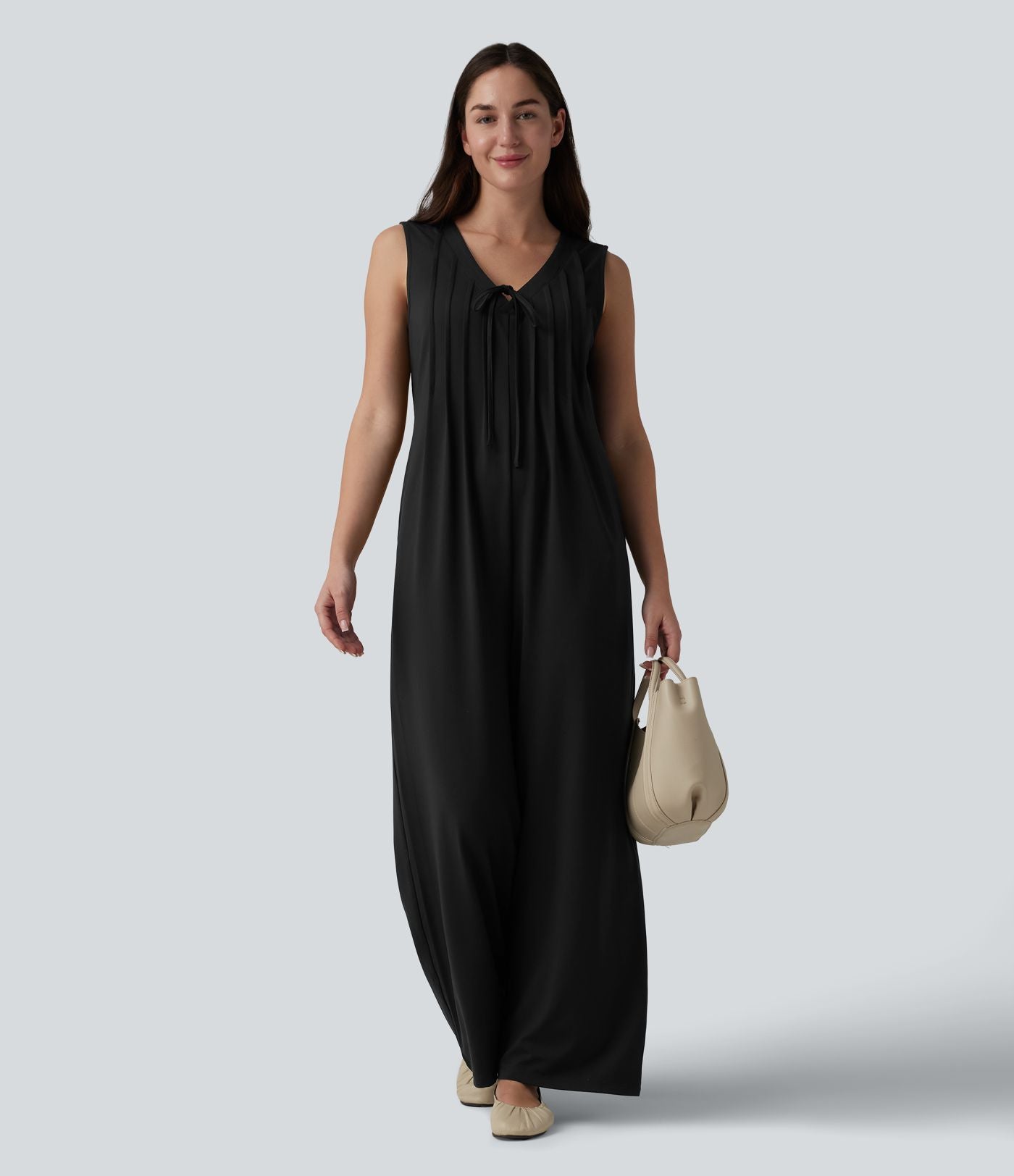 Combinaison casual ample décolleté plongeant sans manches plissée à nœud devant et fermeture éclair invisible avec poches
