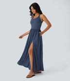 Robe longue fluide fendue avec poches latérales, dos nu et effet torsadé