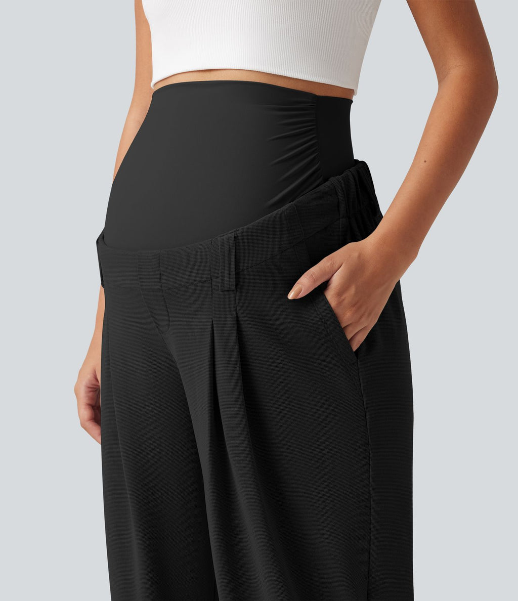 Pantalon de grossesse fuselé taille très haute en tissu gaufré avec poches