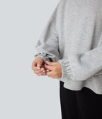 Sweat-shirt col montant à manches longues ourlet asymétrique avec poche