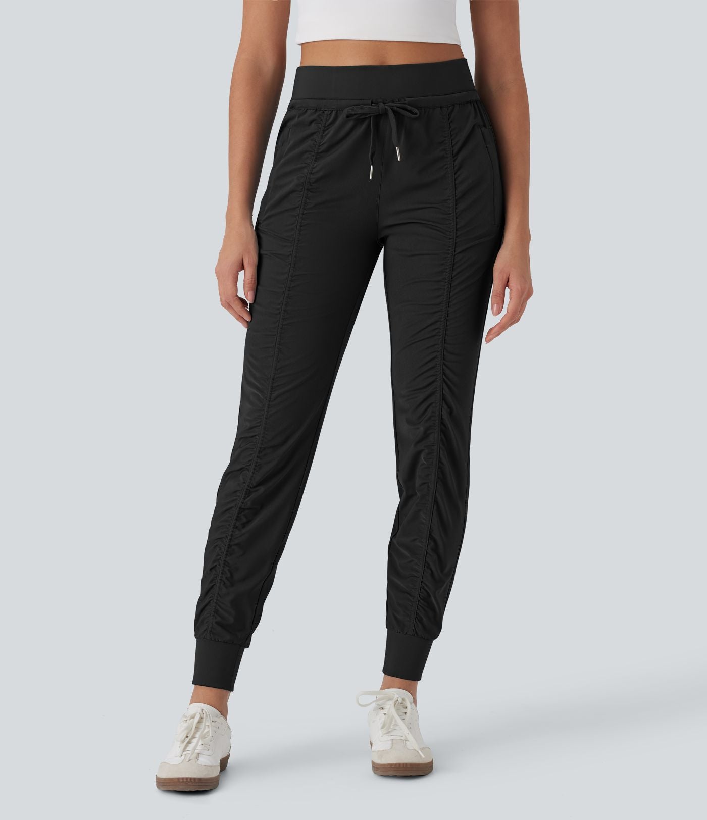 Pantalon jogging de voyage taille haute avec cordon de serrage, coupe fuselée et poches latérales zippées