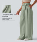 Pantalon casual ample taille haute aspect lin avec ceinture et poches