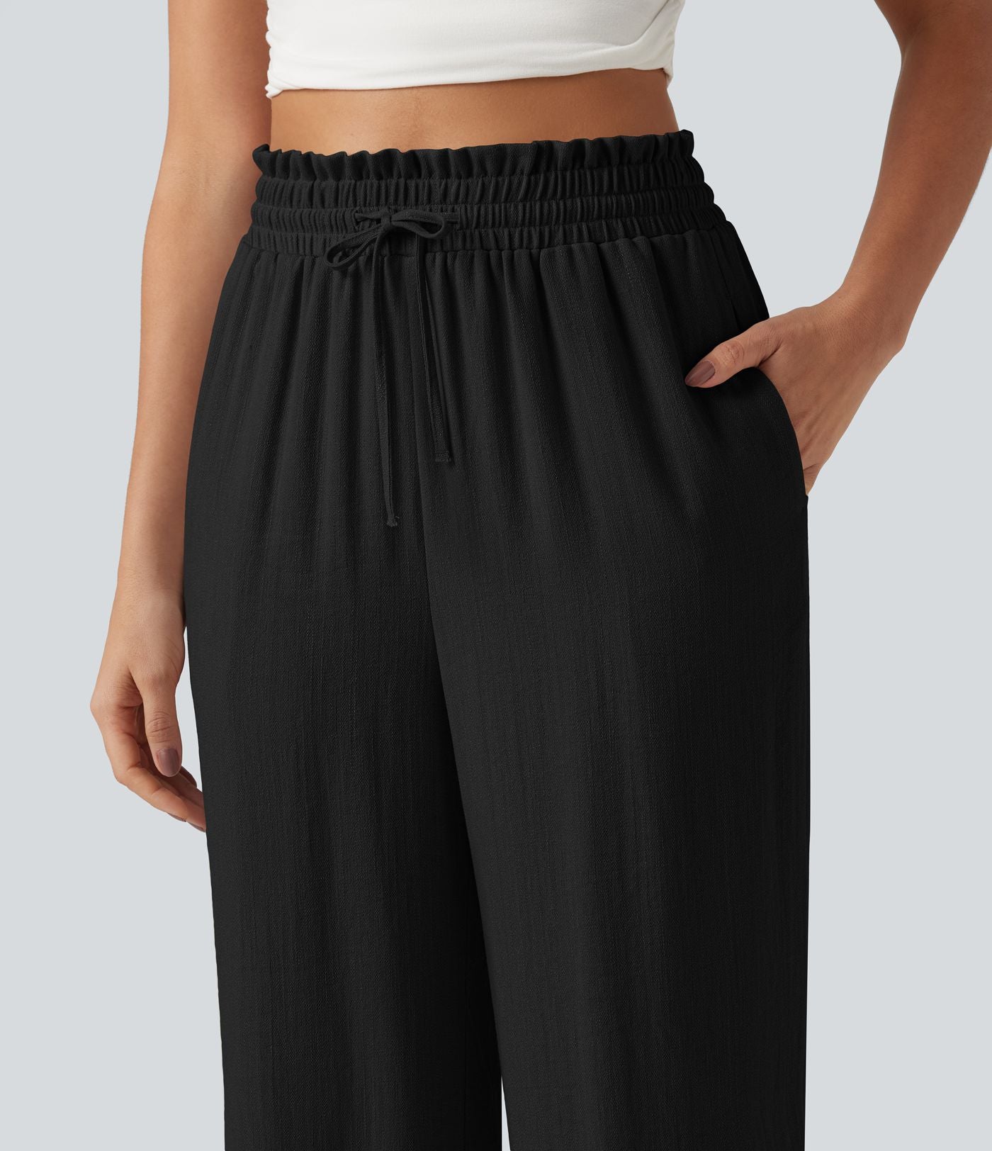 Pantalon effet lin taille haute avec cordon de serrage, bord volanté et poches