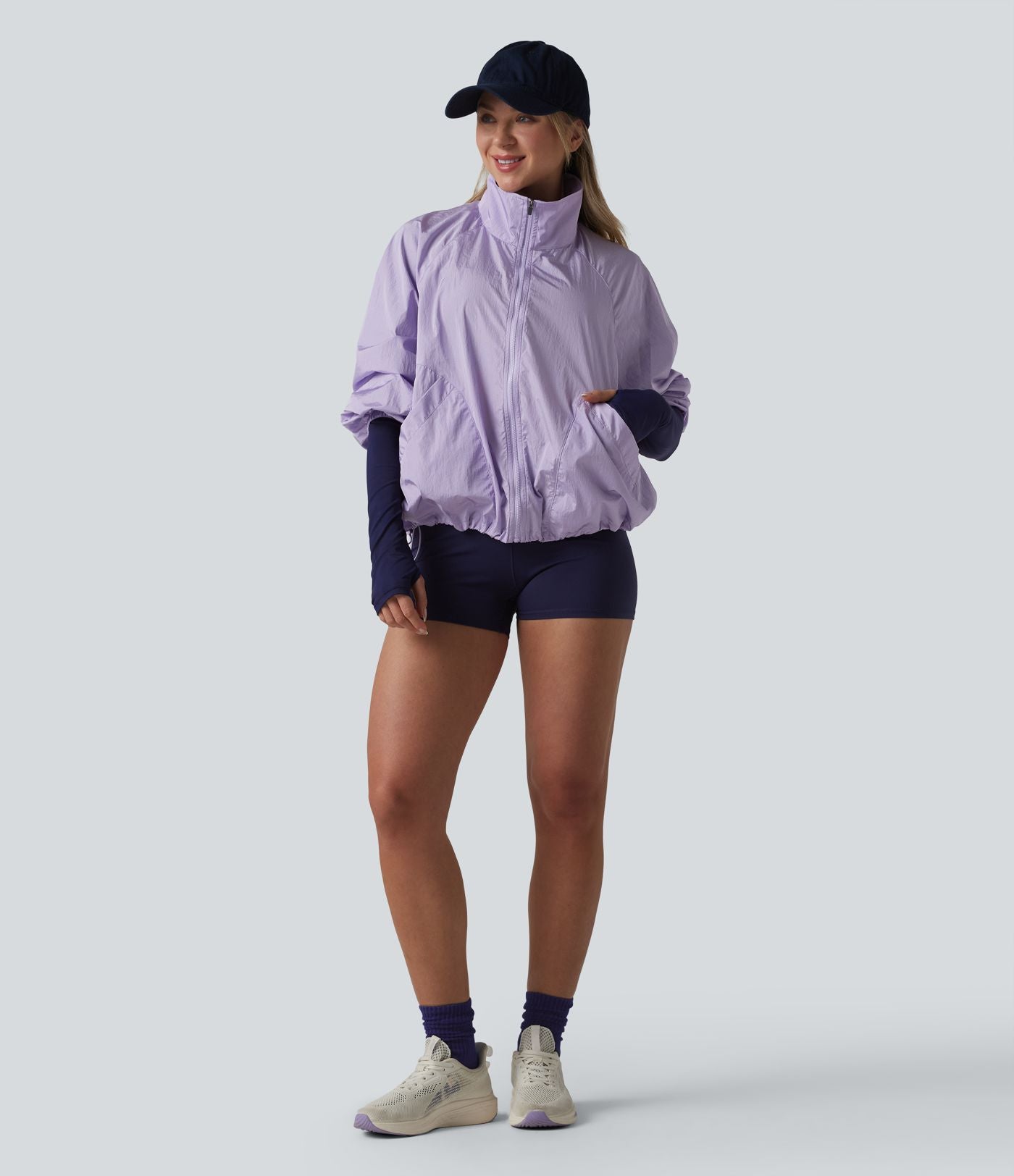Veste de sport déperlante col montant manches longues zippée avec poches