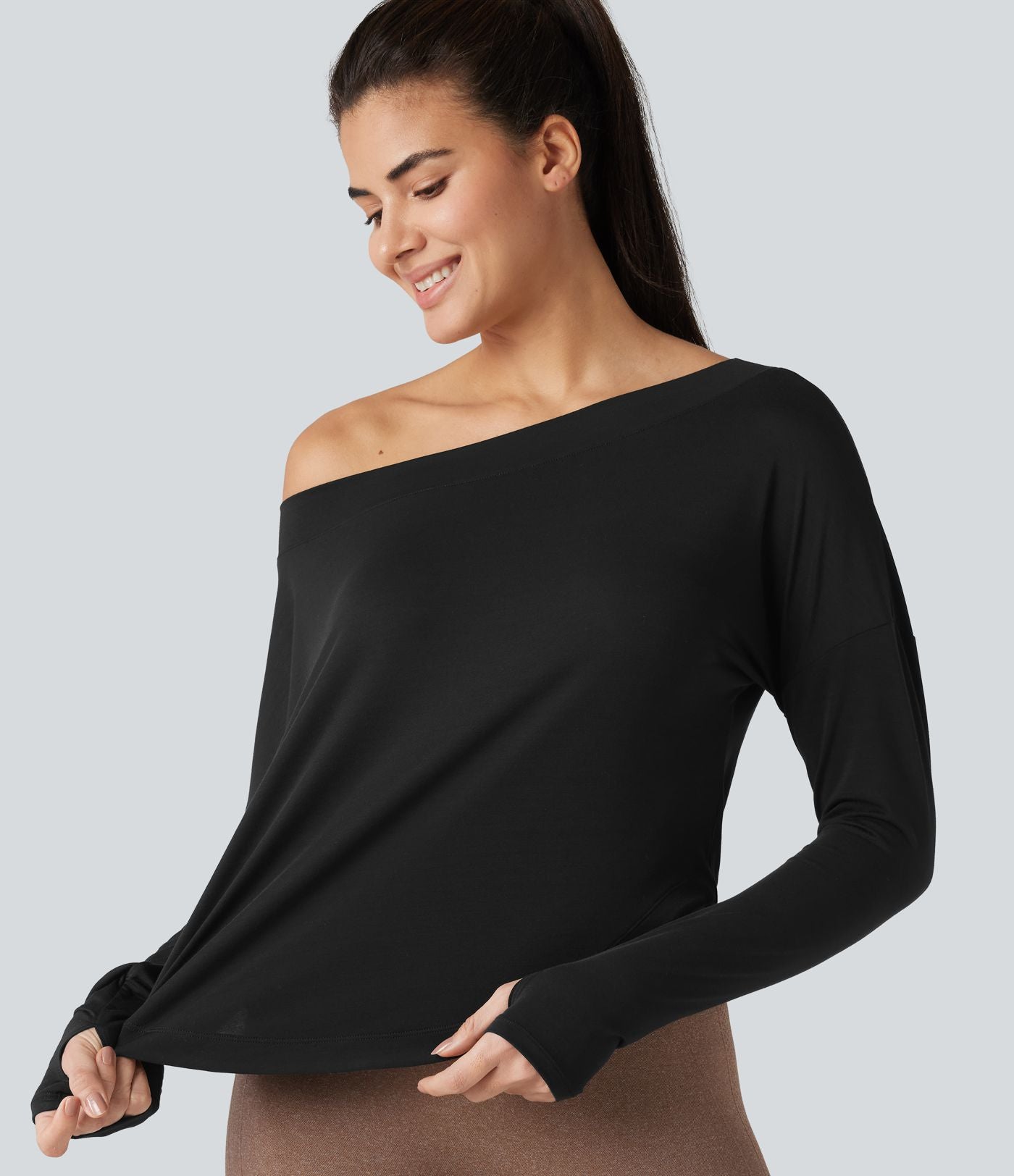 Top de sport yoga asymétrique une épaule manches longues avec trou pour le pouce, ourlet arrondi asymétrique et séchage rapide