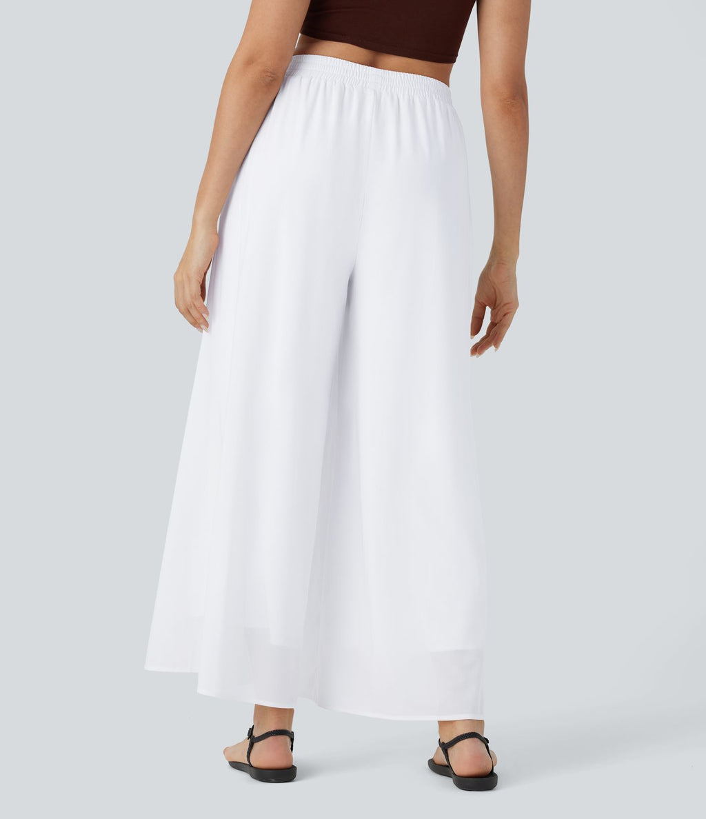 Pantalon fluide et ample avec superposition en mesh, poches latérales et taille haute