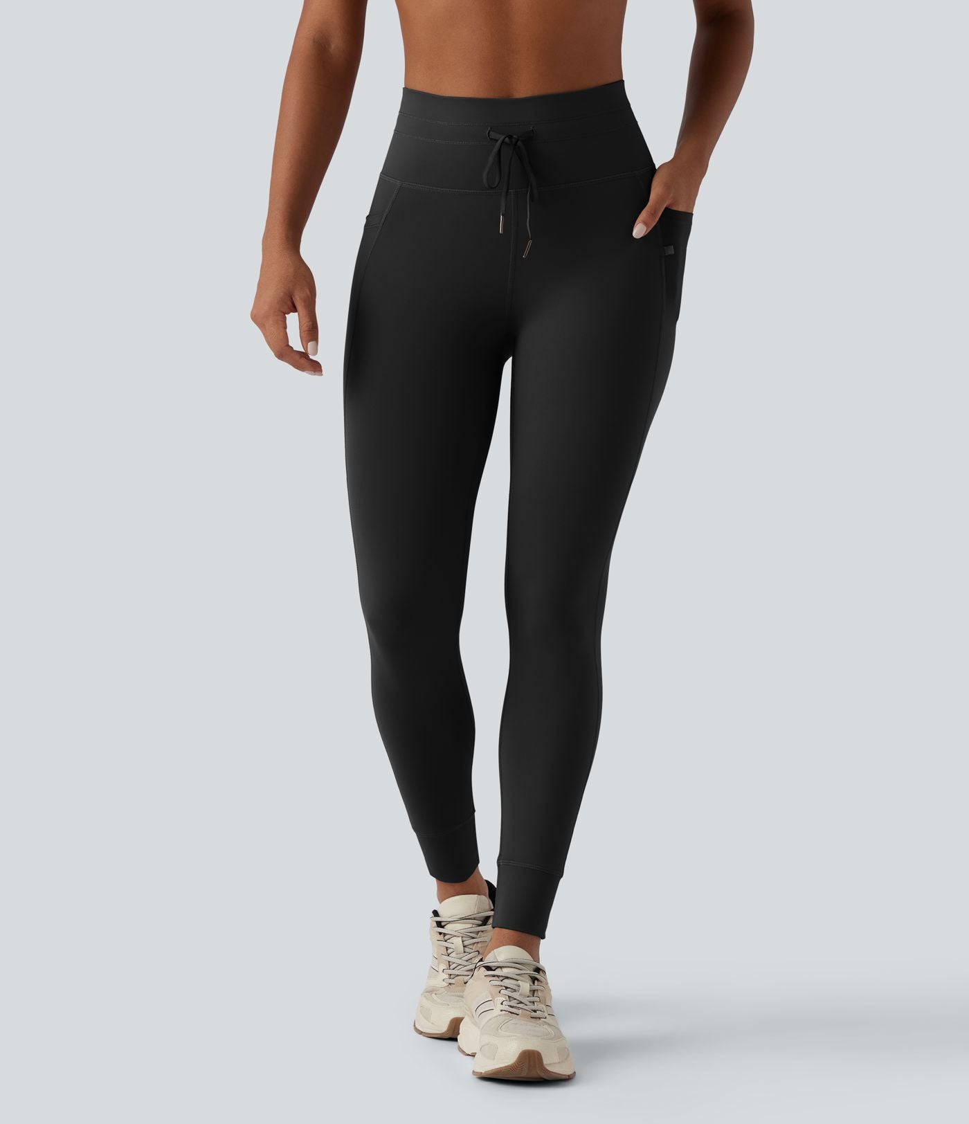 Legging 7/8 de yoga taille haute avec cordon de serrage uni et poches
