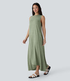 Robe longue décontractée fluide à col rond, sans manches, poches latérales et ourlet asymétrique