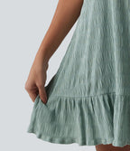 Robe courte décontractée sans manches à col rond, soutien-gorge intégré et ourlet à volants