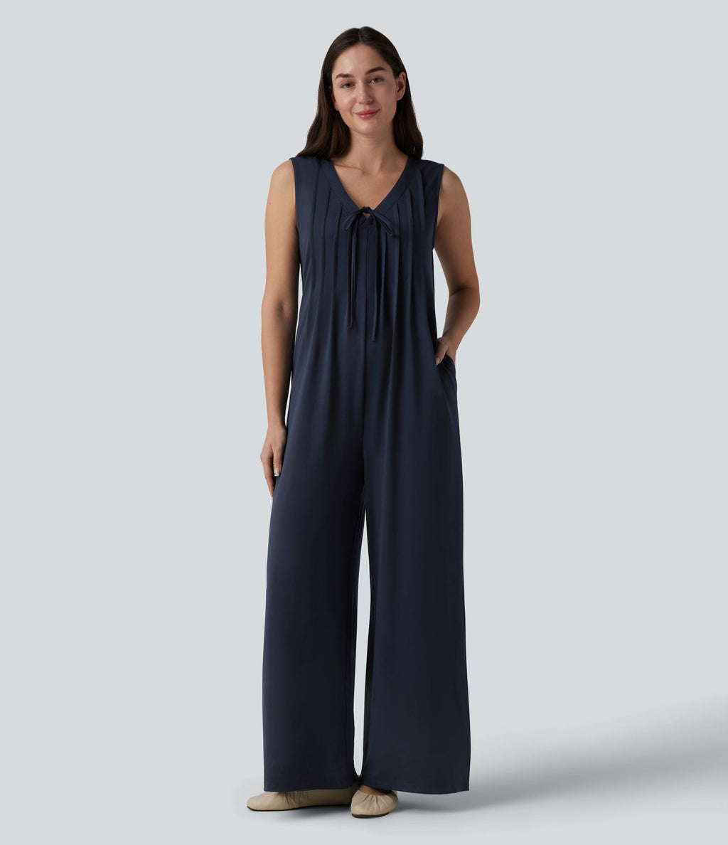 Combinaison casual ample décolleté plongeant sans manches plissée à nœud devant et fermeture éclair invisible avec poches
