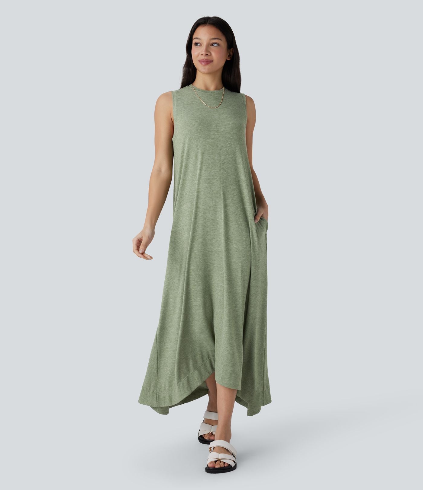 Robe longue décontractée fluide à col rond, sans manches, poches latérales et ourlet asymétrique