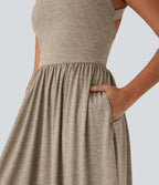 Robe longue fluide fendue avec poches latérales, dos nu et effet torsadé