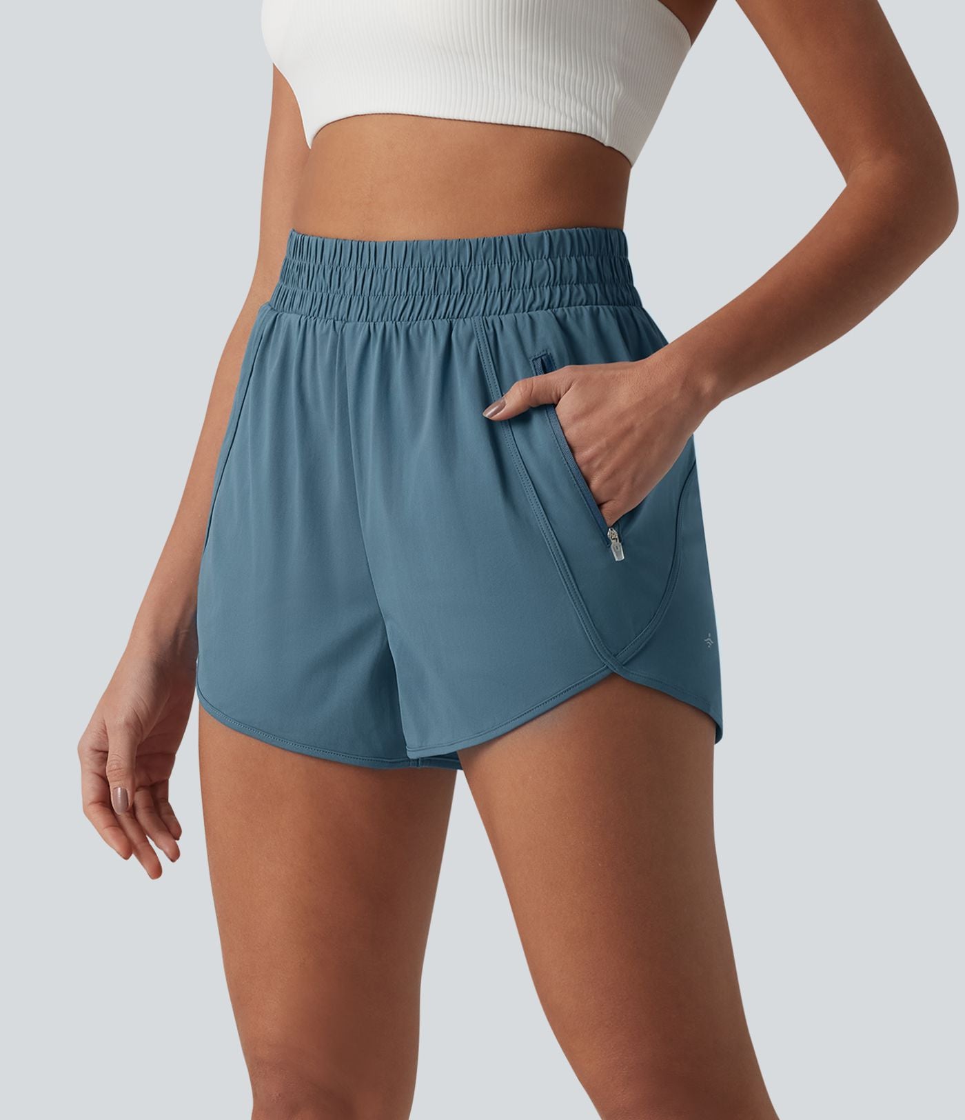 Short de yoga 7,5 cm taille haute à ourlet arrondi et poches