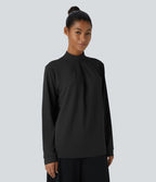 Blouse de travail à col montant, plis, boutons au dos et manches longues