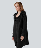 Sweat-shirt long en coton à capuche zippé à manches longues avec ourlet arrondi et poches