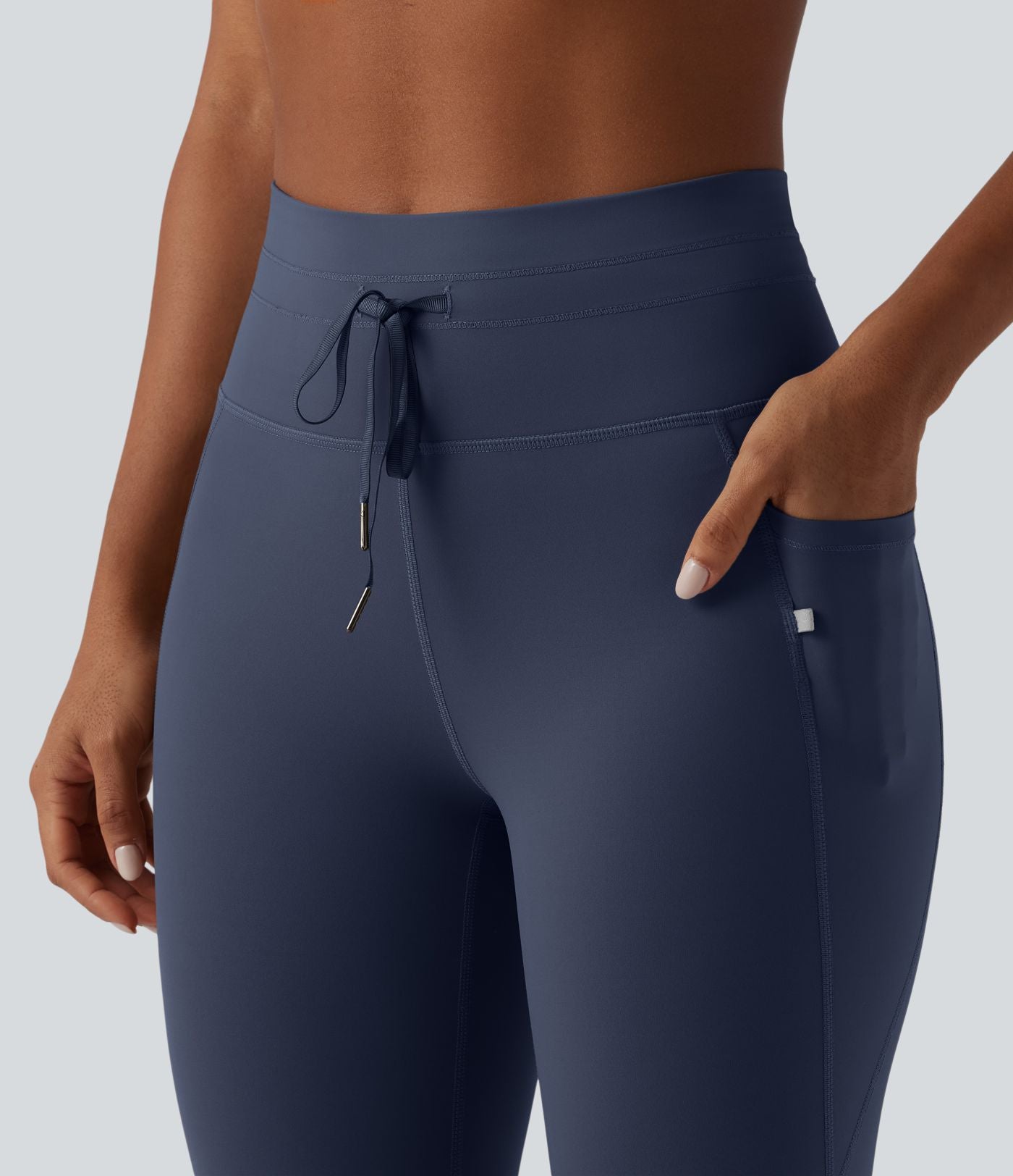 Legging 7/8 de yoga taille haute avec cordon de serrage uni et poches