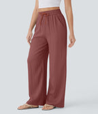 Pantalon large fluide taille haute avec cordon de serrage, poches latérales et aspect lin