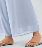 Pantalon fluide et ample avec superposition en mesh, poches latérales et taille haute