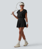 Robe sport de tennis mini 2-en-1 à col V, manches courtes et ourlet plissé avec fermeture éclair invisible et poches