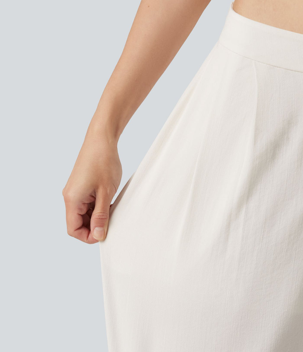 Pantalon large fluide asymétrique taille mi-haute plissé avec poches et aspect lin