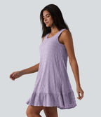 Robe courte décontractée sans manches à col rond, soutien-gorge intégré et ourlet à volants