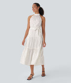 Robe mi-longue fluide de vacances à pois avec col licou, découpe dos, ceinture et poches latérales