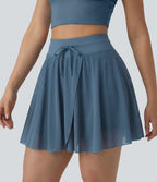 Jupe mini fluide évasée 2-en-1 taille haute à cordon, empiècements en mesh contrastant, avec poche, version plus longue