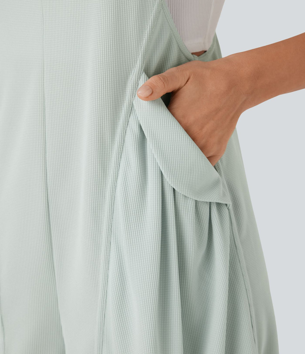 Salopette courte décontractée en tissu gaufré à bretelles ajustables avec boutons et poches latérales