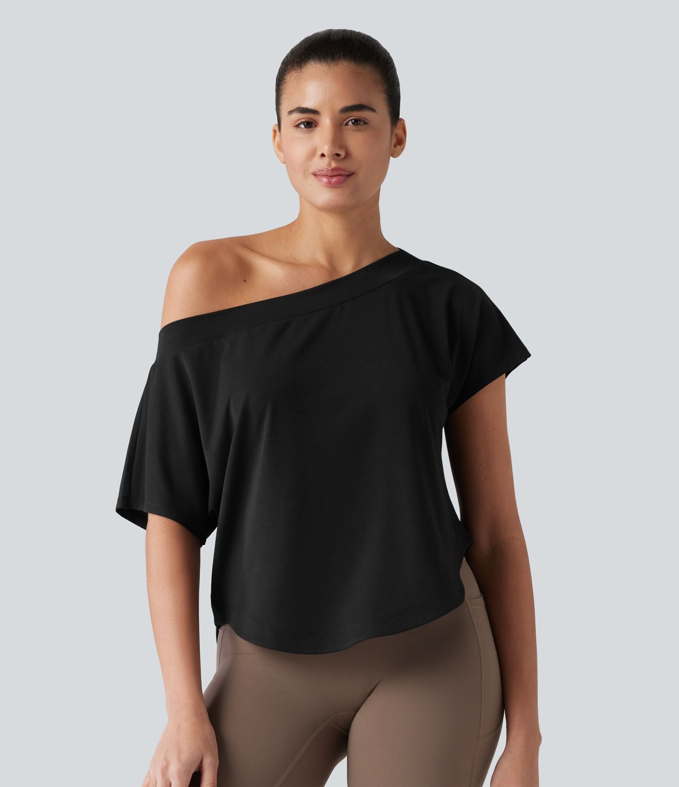 Haut de sport yoga asymétrique à une épaule manches courtes ourlet arrondi asymétrique séchage rapide