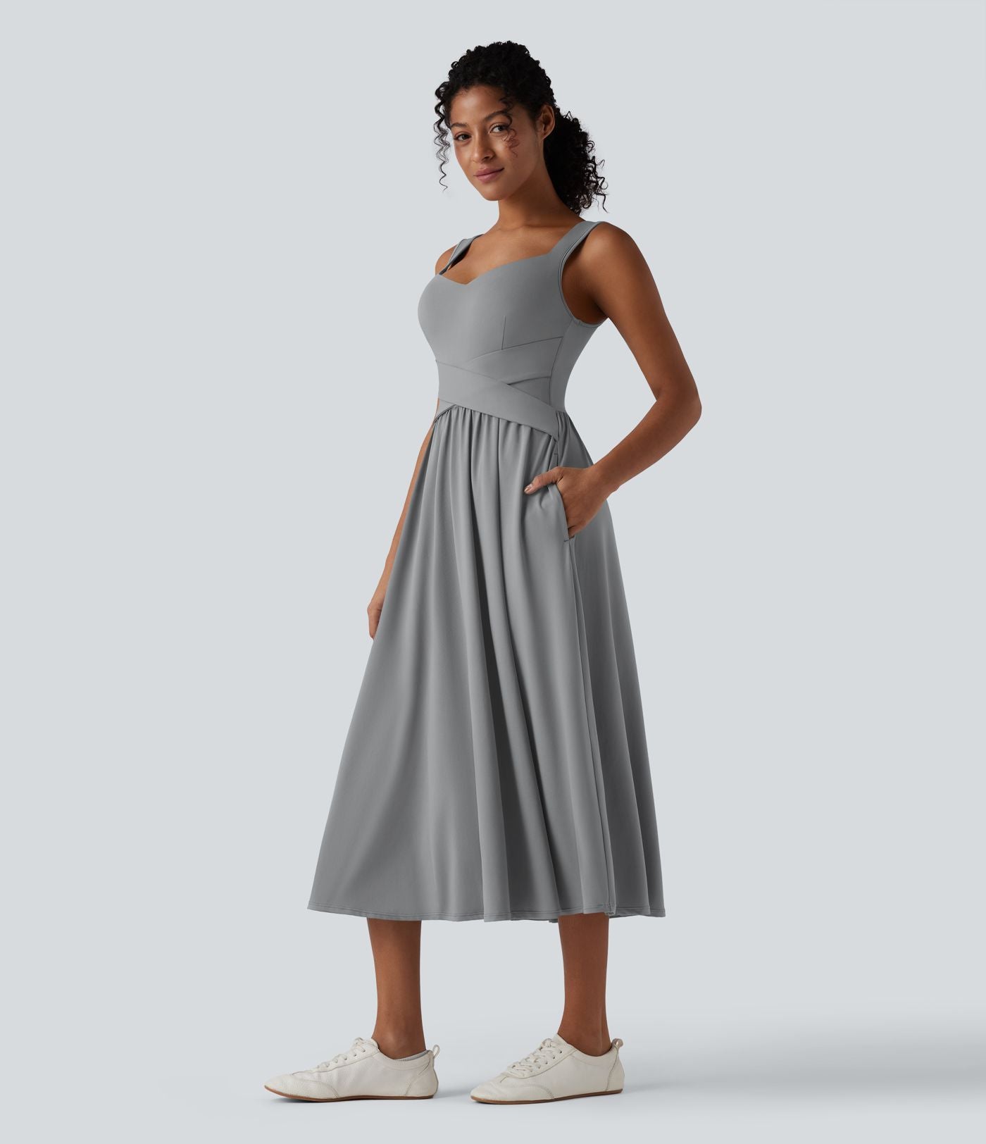 Robe midi fluide sans manches dos croisé ouvert avec poches