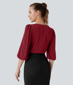 Blouse de travail col bateau avec manches évêque et dos ajouré