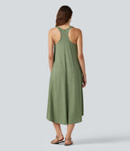 Robe midi fluide à dos nageur, soutien-gorge intégré, ourlet asymétrique et poches