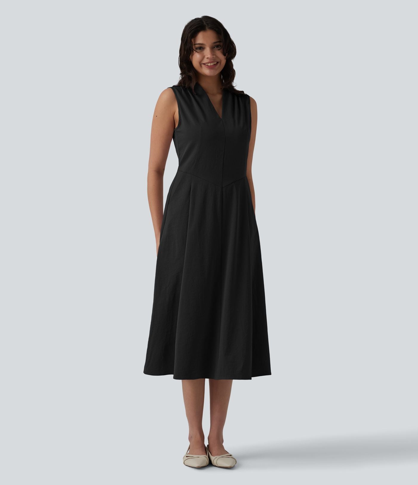 Robe mi-longue plissée col V sans manches avec fermeture éclair invisible et poches pour le travail
