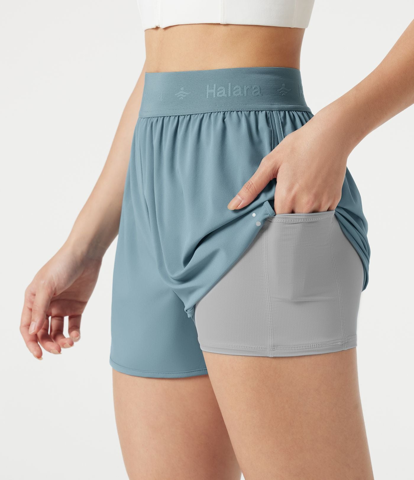 Short de sport 7,5 cm Breezeful™ 2-en-1 séchage rapide taille haute en mesh contrastant à poches