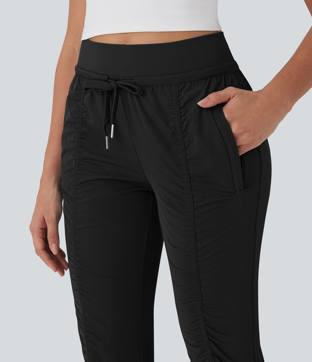 Pantalon jogging de voyage taille haute avec cordon de serrage, coupe fuselée et poches latérales zippées
