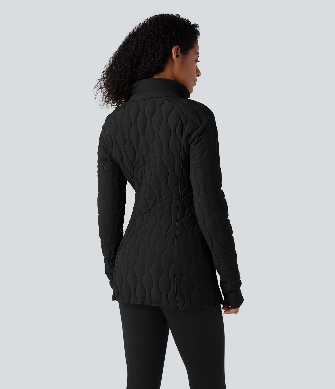 Veste matelassée de sport PuffFlex à col montant, manches longues, fermeture éclair avec passe-pouces et poches