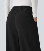 Pantalon tailleur large taille haute croisée avec poches