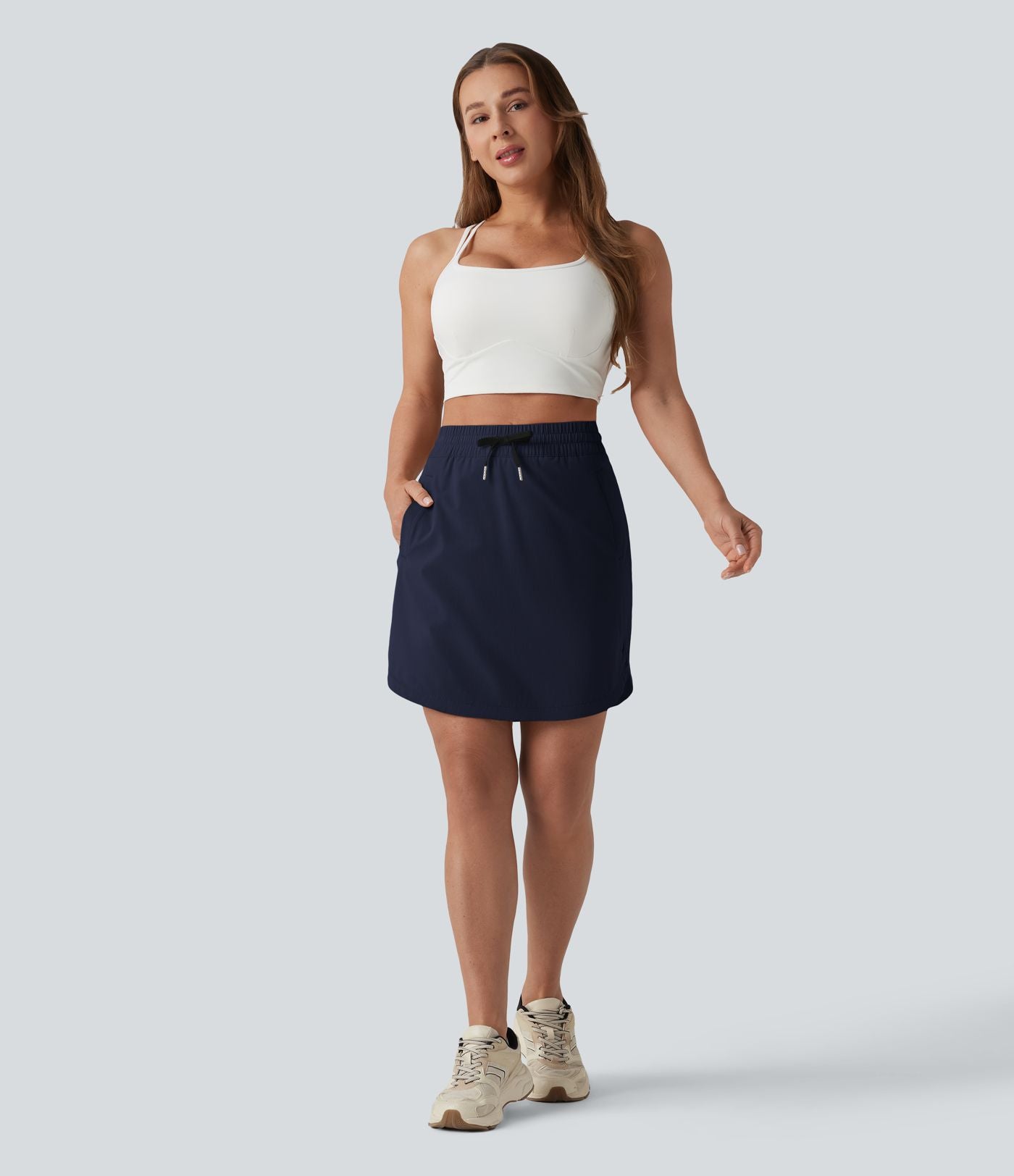 Jupe-short golf mini 2-en-1 taille haute à cordon de serrage et ourlet arrondi avec poches - Longueur plus longue