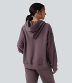 Sweat-shirt de sport casual oversize en molleton à capuche et manches longues avec poches
