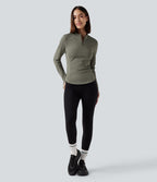 Haut de sport yoga polaire col montant demi-zip à manches longues avec passants pouces