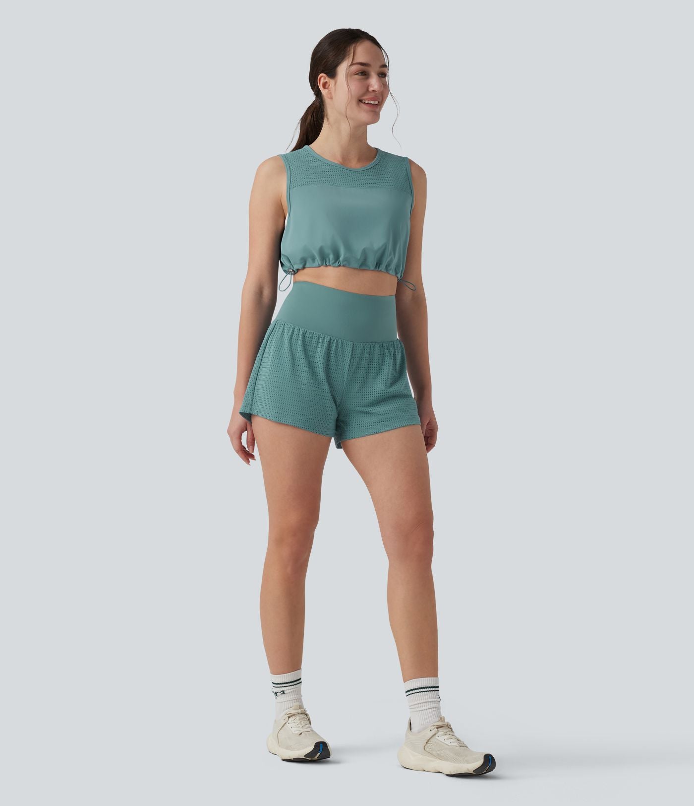 Débardeur yoga court col rond mesh respirant avec ourlet à cordon de serrage