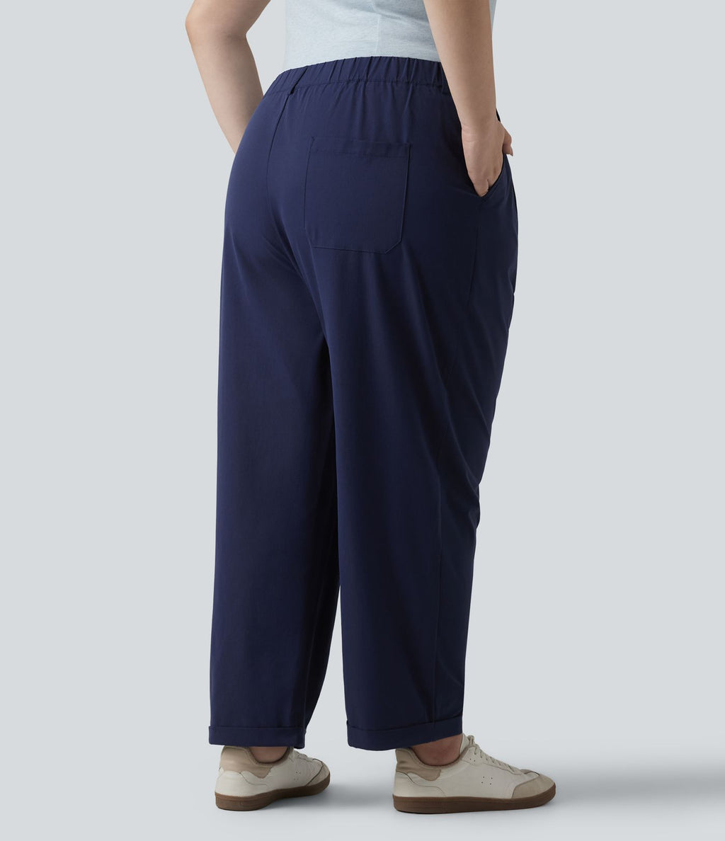 Pantalon grande taille en popeline stretch taille haute, plissé avec ourlet roulotté, longueur 7/8, coupe fuselée, avec poches