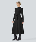 Robe longue côtelée col montant ceinturée manches longues