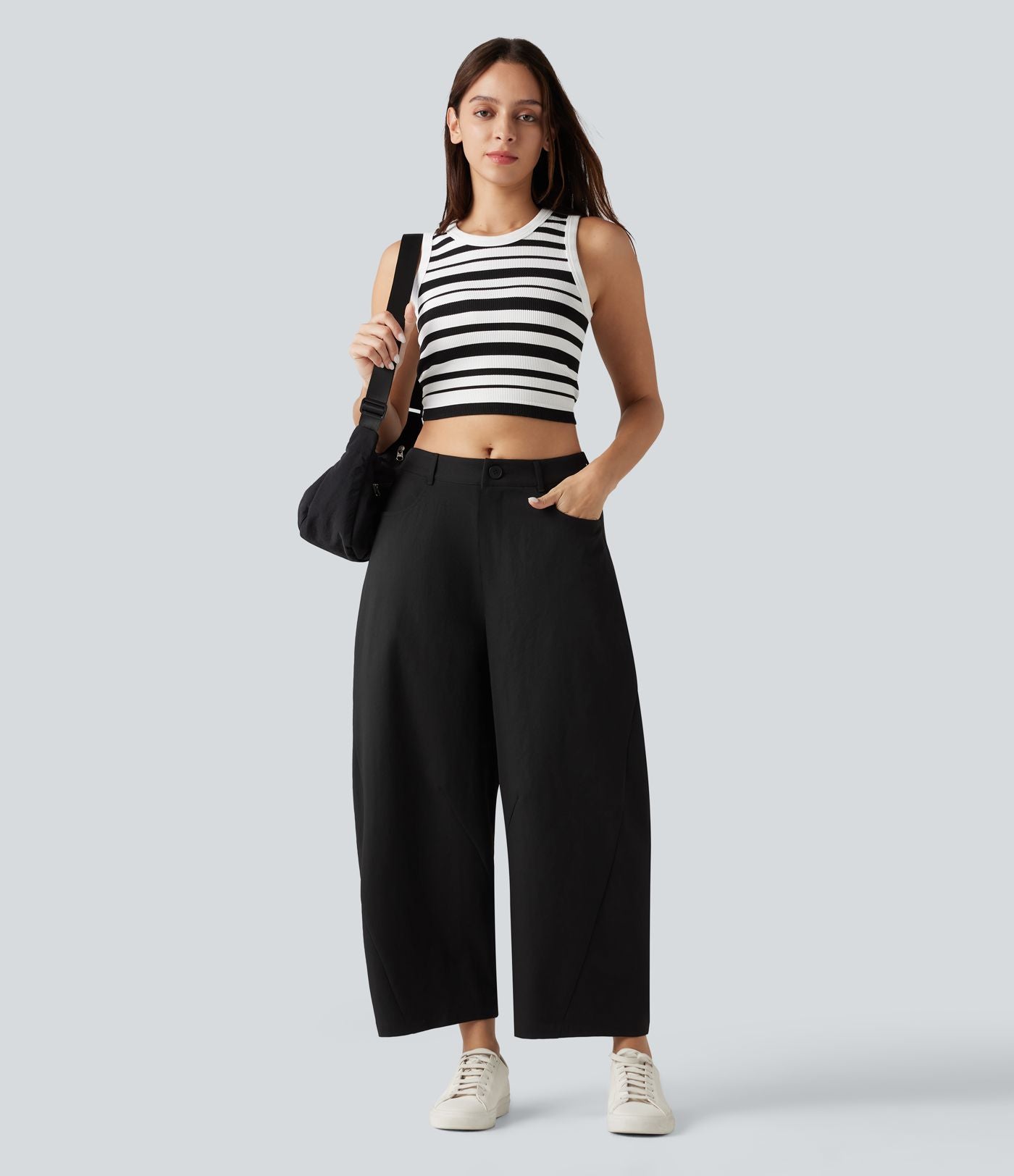 Pantalon décontracté à taille mi-haute, coupe ample et jambes fuselées, avec poches