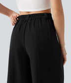 Pantalon tailleur large, taille moyenne, à poches