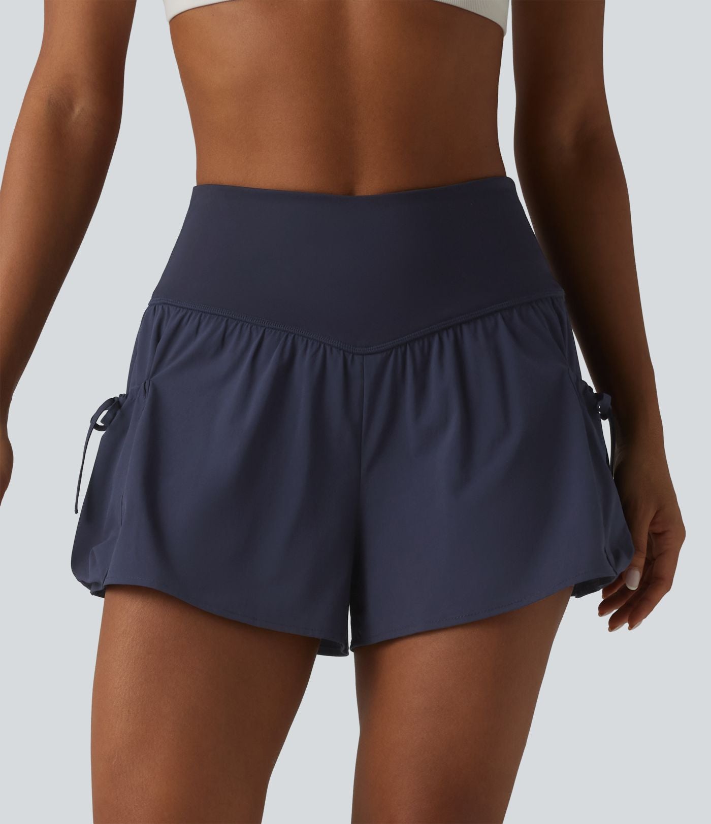 Short de sport ample 2 en 1 taille haute avec poches