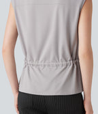 Chemise tailleur sans manches col V avec braguette boutonnée et cordon