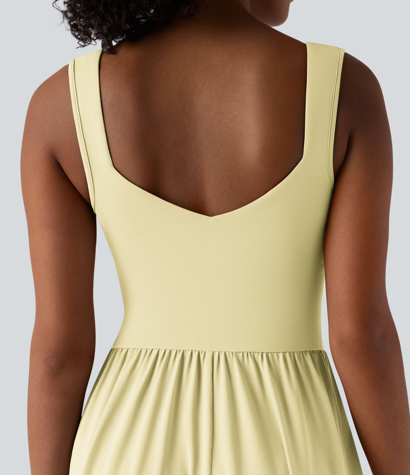 Robe midi fluide sans manches dos croisé ouvert avec poches