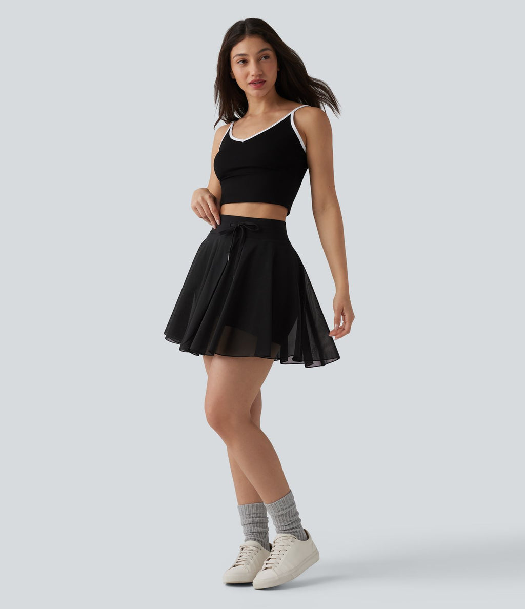 Jupe mini fluide évasée 2-en-1 taille haute à cordon, empiècements en mesh contrastant, avec poche, version plus longue